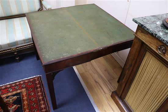 A Georgian mahogany card table with concertina action W.91cm